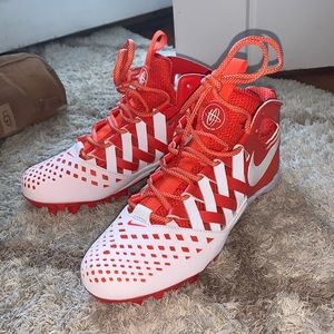 Brand new never worn orange and white cleats
